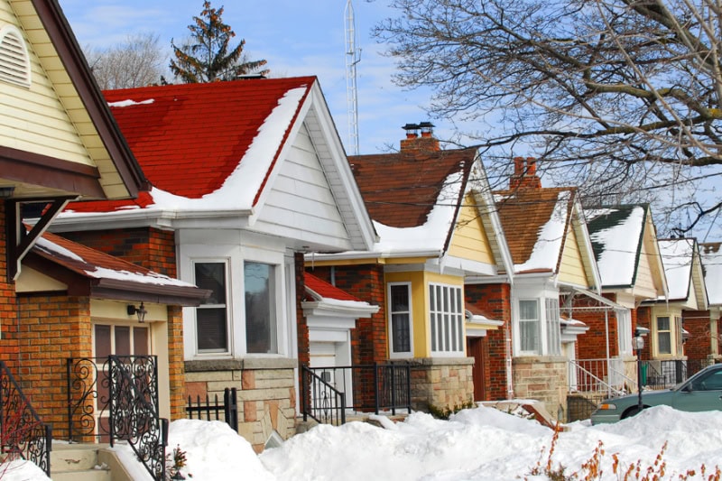 View of homes covered in snow.